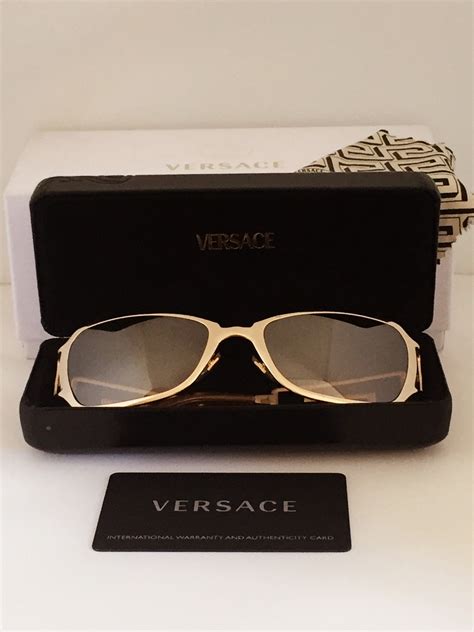 gold versace badge from sunglasses|Versace gold sunglasses vintage.